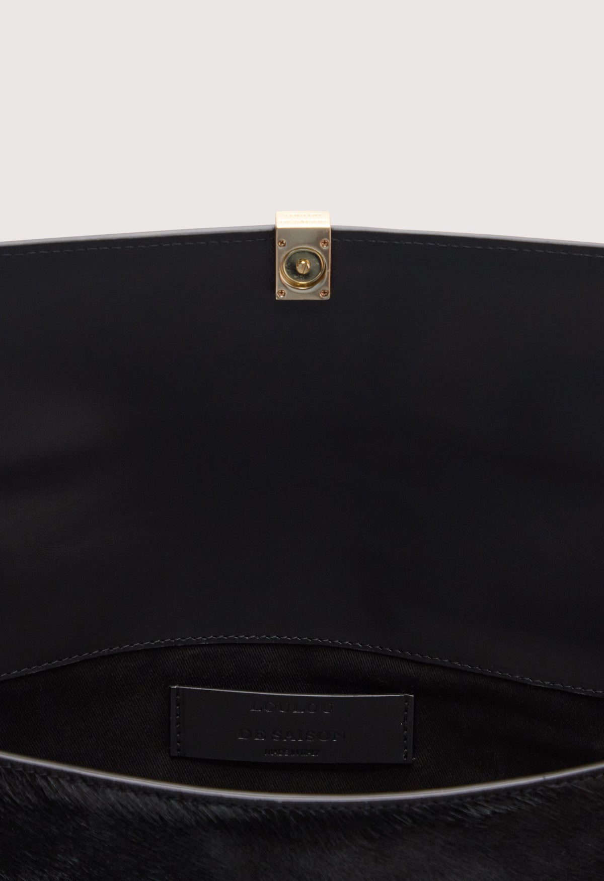 SIMONE Pony-effect leather clutch