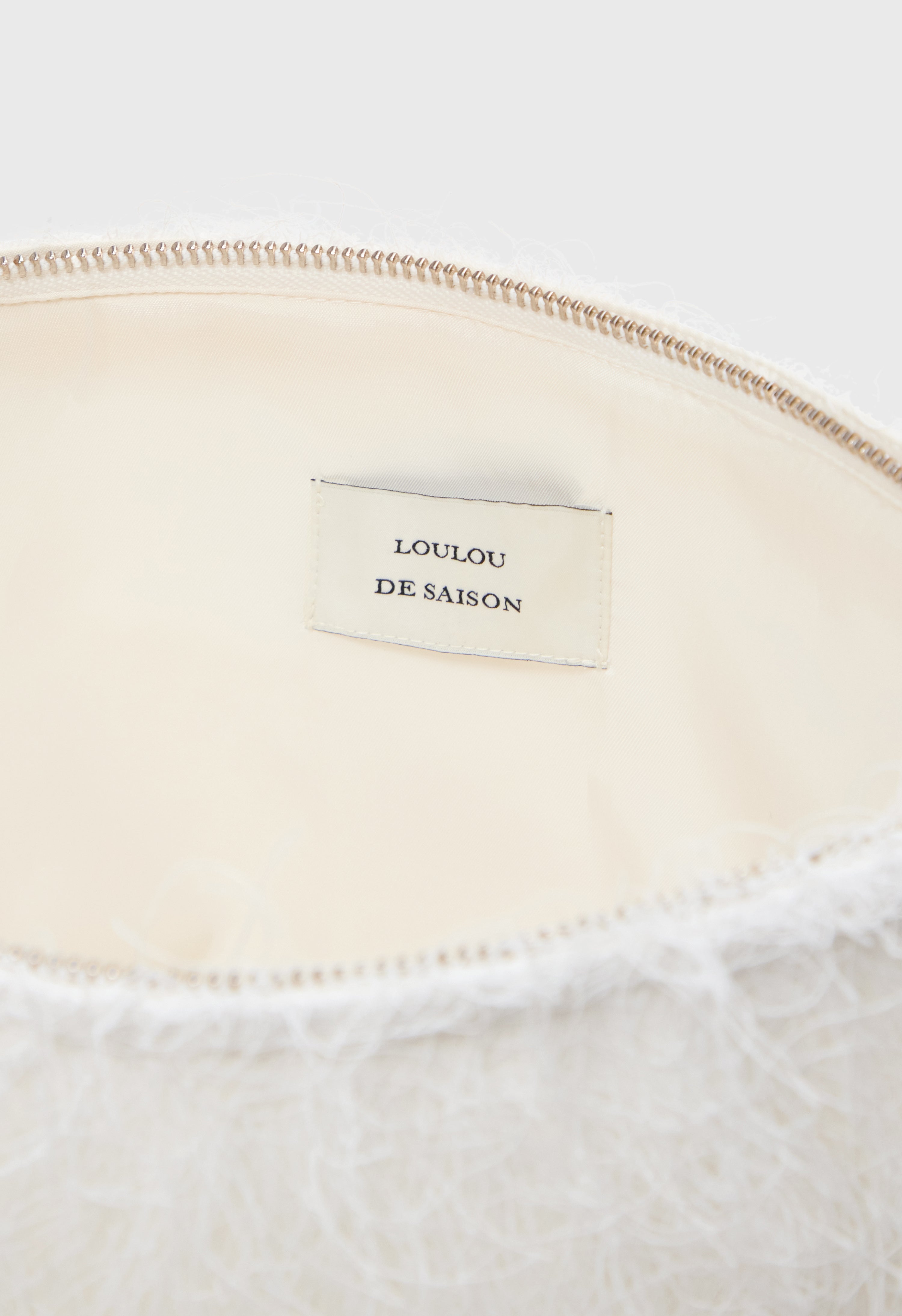 EVANO Fringed clutch