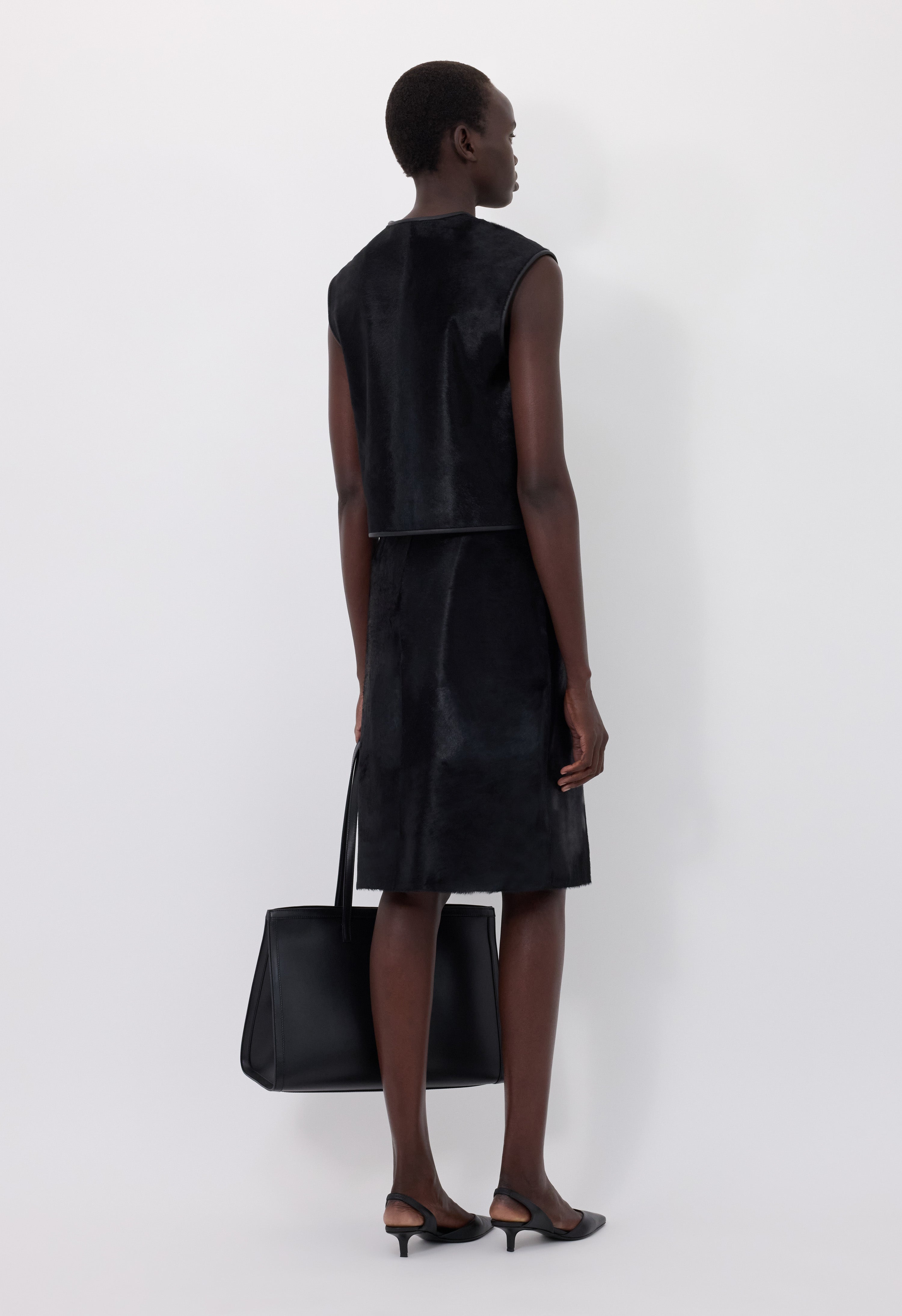 MYRA Asymmetrical pony-effect leather skirt